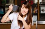 Portrait Of Thai Adult Student University Uniform Beautiful Drinking Coffee Stock Photo