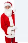 Aged Santa Holding Blank White Banner Ad Board Stock Photo