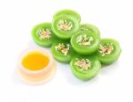 Green Multiple Scented Sesame Chinese Sweet And Liquid Sugar On White Floor Stock Photo