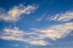 Blue Sky Background With Tiny Clouds Stock Photo