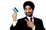 Businessman Holding Up Credit Card Stock Photo