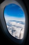 Blue Sky White Cloud ,looking Through Airplane Window Frame Stock Photo