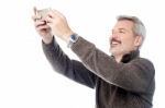 Happy Aged Man Taking Pictures Of Themselve Stock Photo