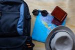 Top View Of  Backpack Bag With Other Travel Accessories On Woode Stock Photo
