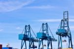 Blue Cargo Cranes At Sea Port Stock Photo