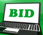 Bid On Laptop Shows Bidder Bidding Or Auction Online Stock Photo
