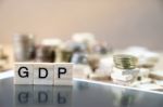 Gdp  Word Written In Wooden Cube Reflection On Black Mirrow With Stock Photo