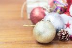 Balls And Gift On Wooden Stock Photo