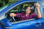 Woman Driving Car  Showing Car Key Stock Photo