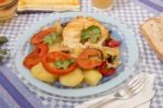 Fish With Potatoes And Tomato Stock Photo