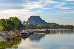 Lake In Lopburi, Thailand With A Holy Mountain In The Background Stock Photo
