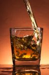 Whiskey Splash In A Glass Stock Photo