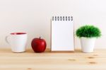 Wood Desk With Notepad And White Mug Stock Photo