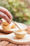 Mini Pies On Wooden Plate Stock Photo