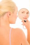 Woman Looking In Mirror Stock Photo