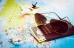 Sunglasses, Passport, Money, Compass And Aircraft On The World M Stock Photo