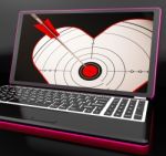 Target Heart On Laptop Shows Flirting Stock Photo