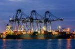 Containers Loading By Crane In The Twilight , Trade Port , Shipp Stock Photo