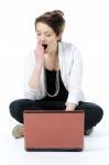 Bored lady yawning with laptop Stock Photo