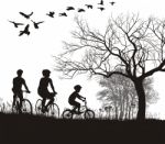 Family Cycling In Countryside Stock Photo