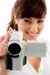 Smiling lady Using Camcorder Stock Photo