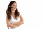 Folded Arm Female Talking On Headphone Stock Photo