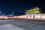 Geyongbokgung Palace And Car Light At Night In Seoul, South Korea Stock Photo