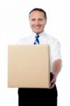 Businessman Holding A Carton Box Stock Photo