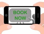 Book Now Phone Shows Reserving Or Arranging Stock Photo