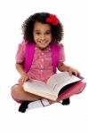 Smiling Pretty School Girl Reading A Book Stock Photo