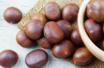 Roasted Chestnuts On Sackcloth Stock Photo