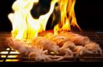 Grilled Fresh Squid On Flaming In Seafood Stock Photo