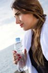 Woman Drinking Water After Sport Activities Stock Photo