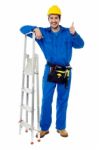 Plumber Posing Confidently With Thumbs Up Stock Photo