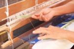 Woman Hand Weaving Pattern On Loom Stock Photo