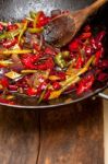 Fried Chili Pepper And Vegetable On A Wok Pan Stock Photo