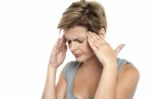 Woman Having Headache. Holding Her Head Stock Photo