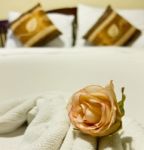 Bed In Boutique Hotel With Rose Stock Photo