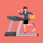 Businesswoman Running On A Treadmill Stock Photo