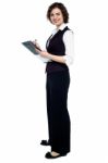 Charming Business Lady Posing With A Clipboard Stock Photo