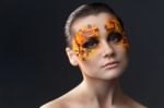 Orange And Red Rhinestones On A Girl Face Stock Photo