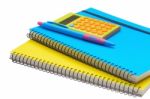 Yellow And Blue Note Book Calculator And Pen Stock Photo