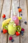 Fresh Blended Fruit Smoothies In Vintage Milk Bottles Stock Photo
