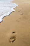 Footprints On The Shoreline Stock Photo
