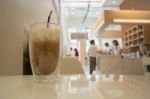 Glass Of Iced Milk Coffee Drink Stock Photo