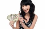 Attractive Young Woman Holding Money Stock Photo