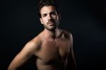 Handsome Muscular Male Model Posing Over Black Background Stock Photo