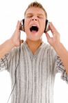 Young Handsome Man Enjoying Music With Headphones Stock Photo
