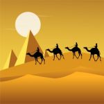 Camel Caravan In Desert Stock Photo