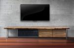 Led Tv On Concrete Wall With Wooden Furniture In Living Room Stock Photo